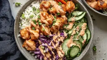 Natural Zepbound Recipe Bang Bang Chicken Bowl with rice, cucumbers, and spicy sauce